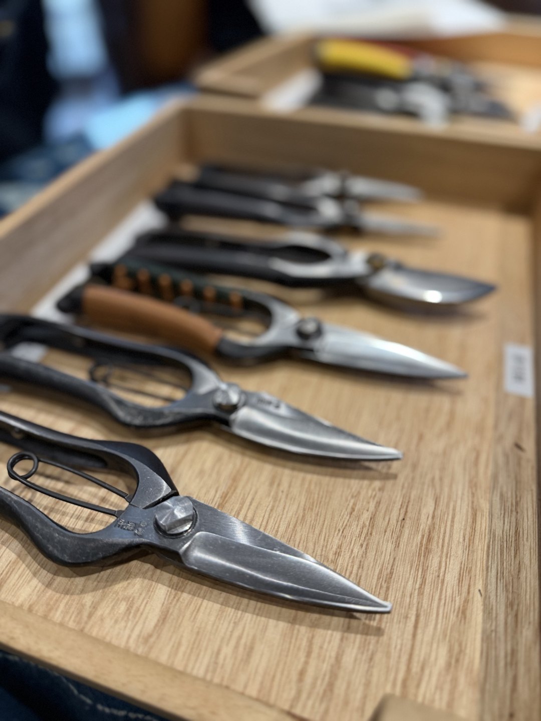 Shears with wrapped handles lying in a tray