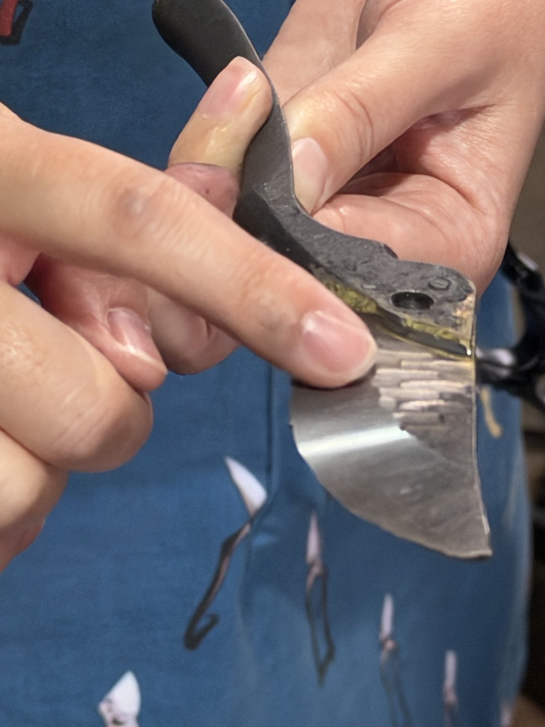 Hands holding a brazed blade