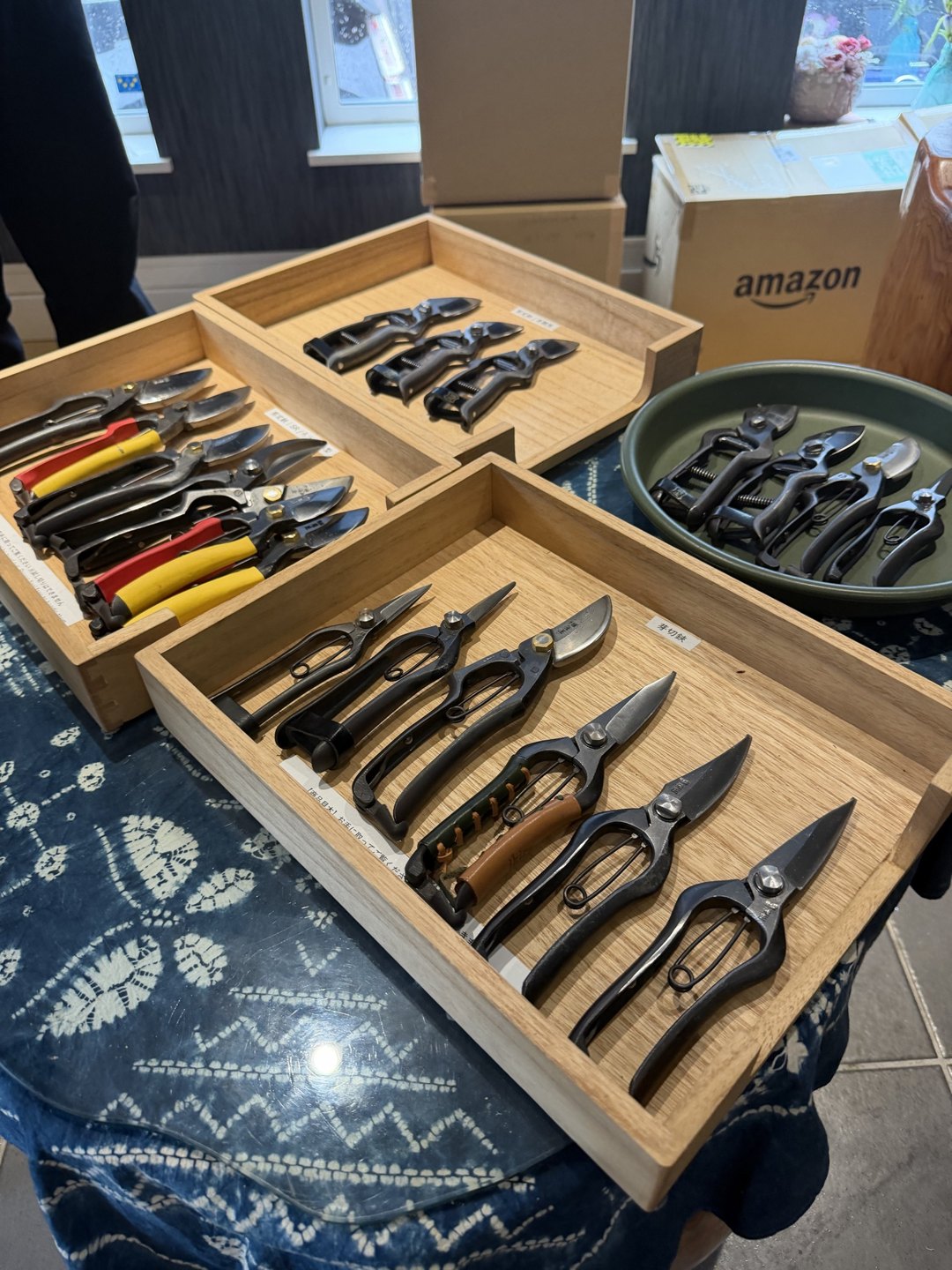 Showroom trays holding shears with black handles