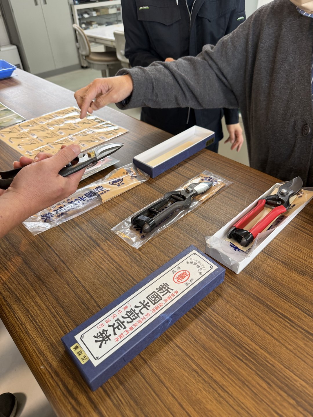 Boxed shears laid out on a shop table